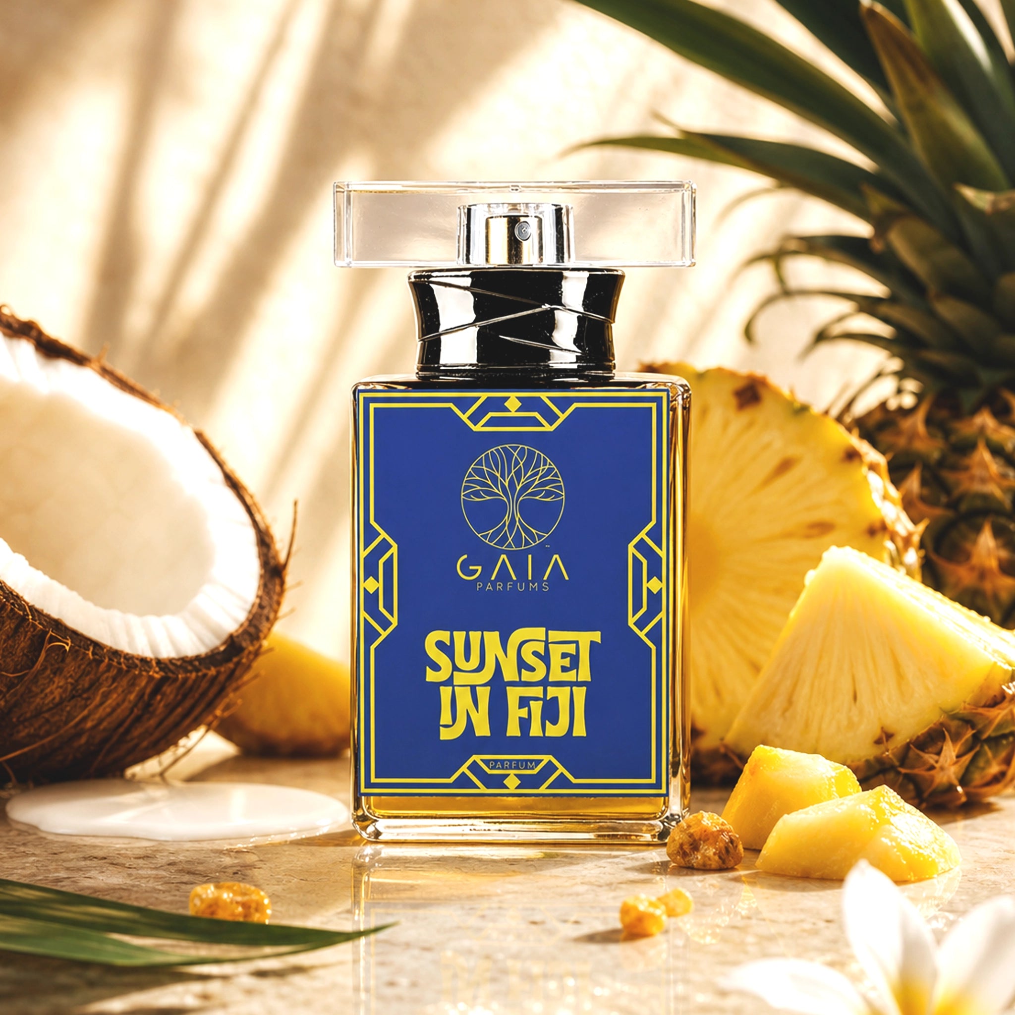 Perfume bottle labeled 'Sunset in Fiji' with a pineapple, coconut, and flower in the background. Sunset in Fiji by GAIA Parfums bottle with tropical citrus woody perfume inspired by Fiji, featuring yuzu, mandarin, jasmine, sandalwood, musk, and Haitian vetiver.