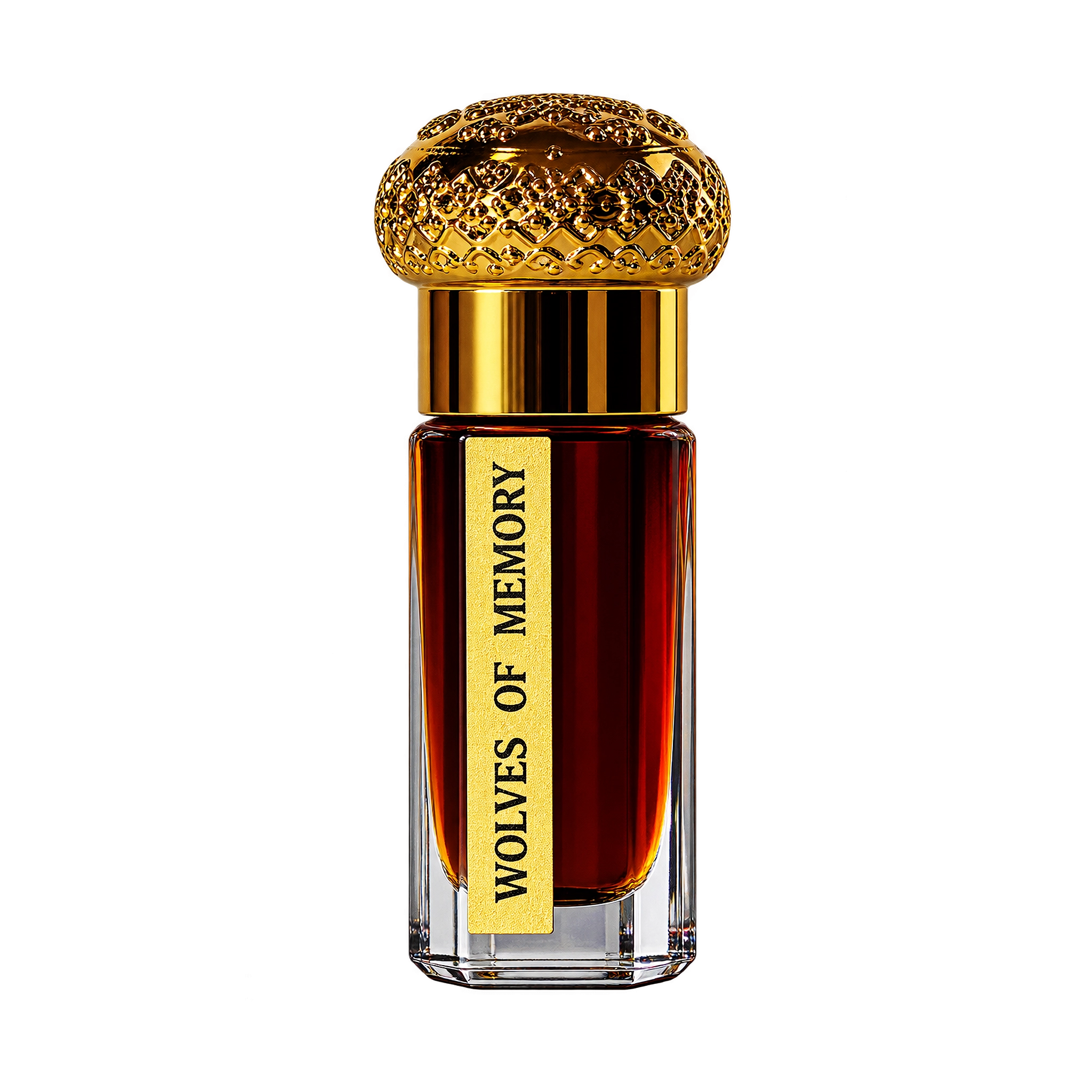 A 2.98 gm Attar bottle with a textured gold cap, a gold collar, and a yellow label reading 'WOLVES OF MEMORY' against a dark amber liquid, isolated on a white background.